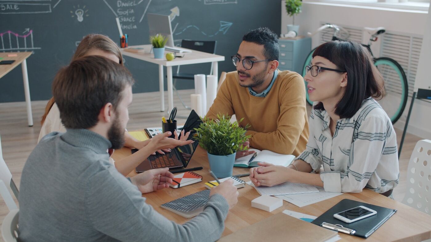 small business team reviewing hubspot dashboard laptop