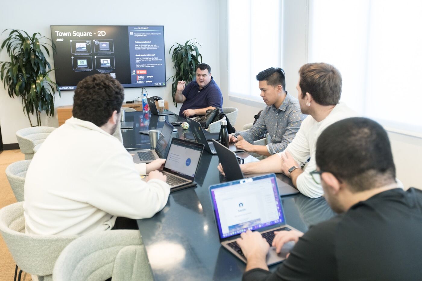 customer support team reviewing helpdesk dashboard analytics