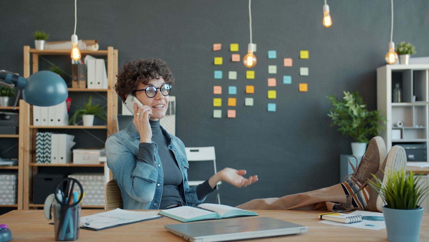 modern office workspace customer success manager reviewing metrics