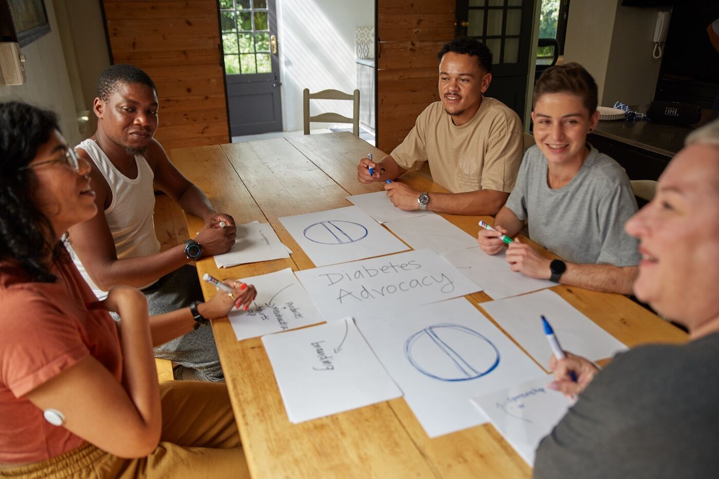 marketing team reviewing HubSpot dashboard meeting