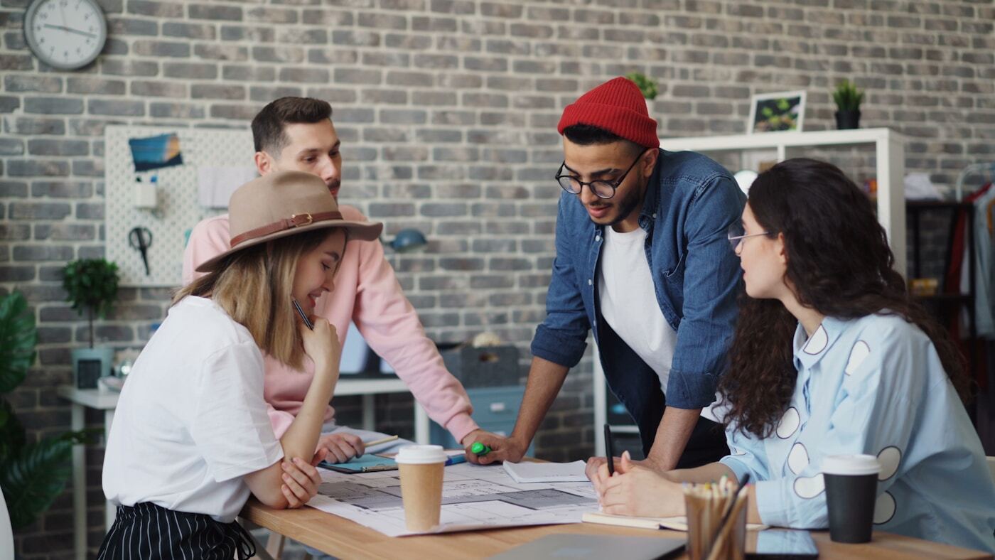 marketing team reviewing customer analytics on screen