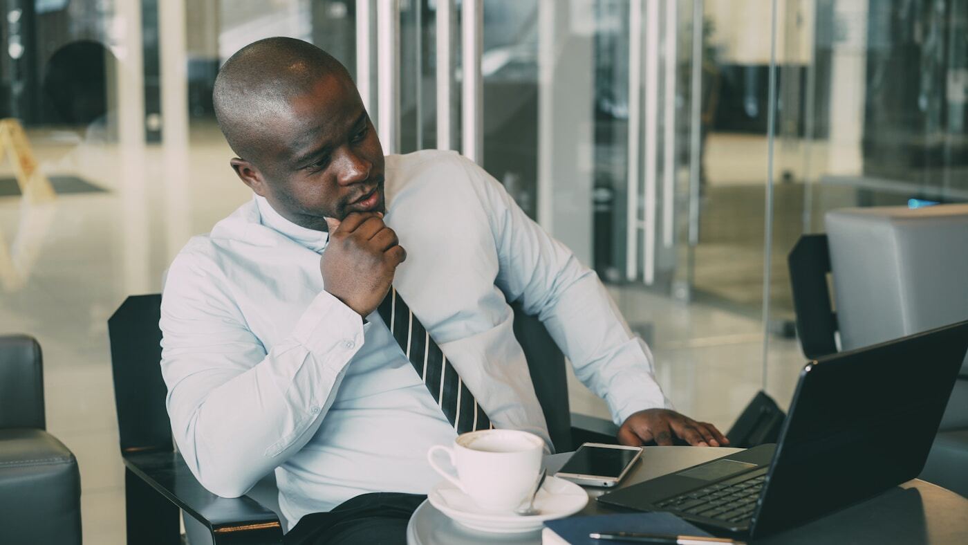 business professional reviewing customer data on laptop dashboard